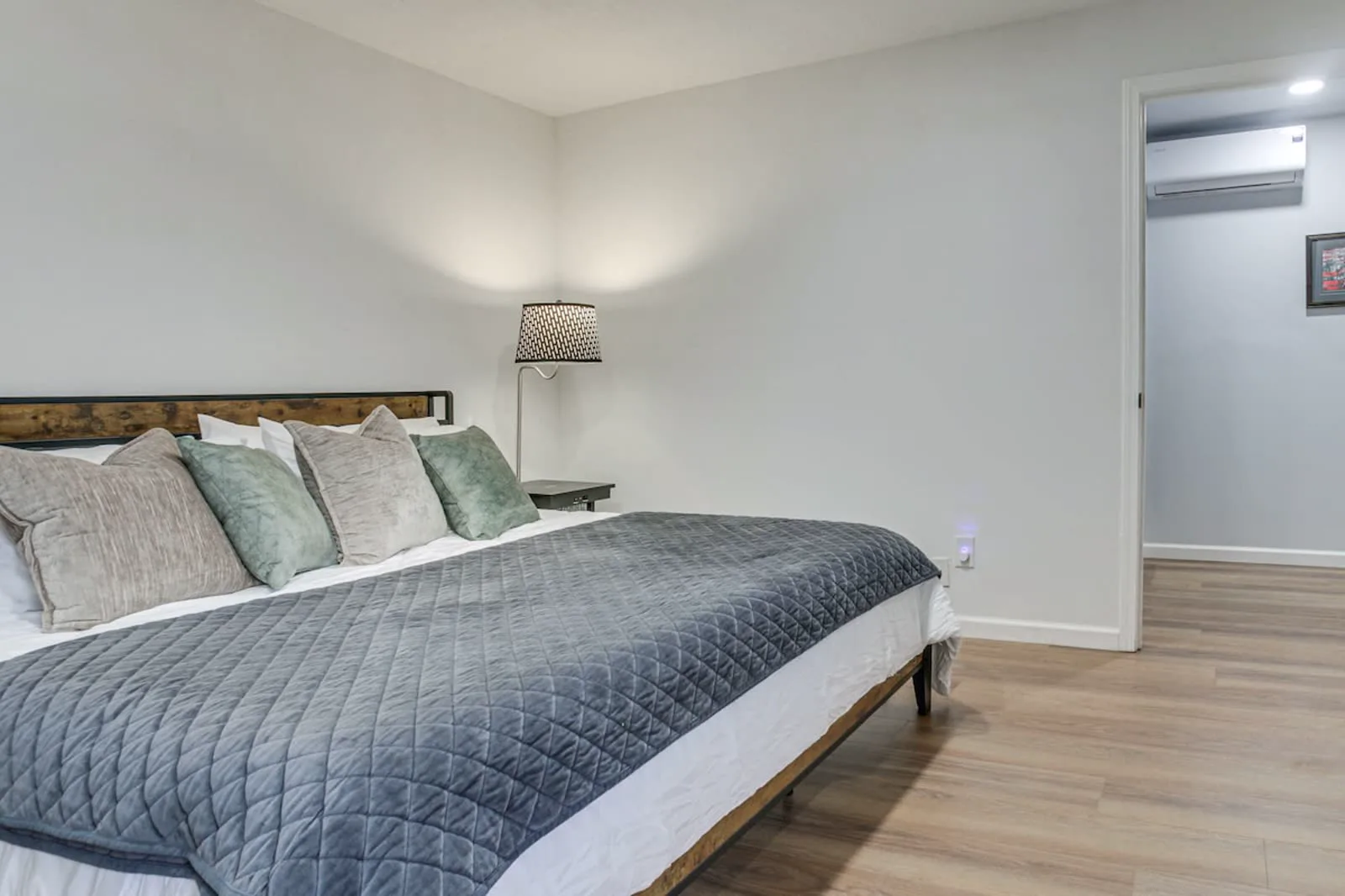 Remodeled bedroom — new flooring, lighting, and finish work